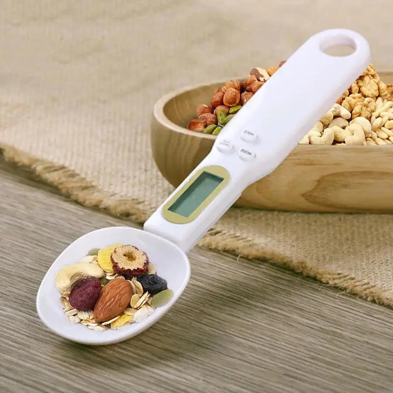 Digital measuring spoon with food.